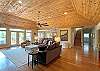 Great room looking toward the deck and kitchen area.  Recently installed beautiful wood ceiling