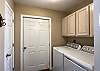 Laundry Room is adjacent to the Kitchen
