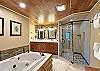 King Bedroom Bath has jetted tub, walk-in shower and two sink vanity