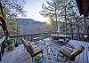 Relax on the spacious deck as you soak in the serene mountain vistas from the comfort of our chairs.