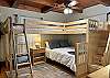 Main Level Guest Bedroom with 2 extra-long Twin Bunk Beds on top and a Queen Bed below.