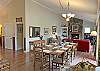 Dining/Family Room and Entry Foyer viewed from  Kitchen.  Master Bedroom with ensuite Bath is first door on the left,  Separate Powder Room off the Foyer also serves the main level.