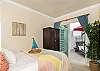 queen bed with patio access