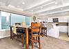dining table and kitchen with ocean view