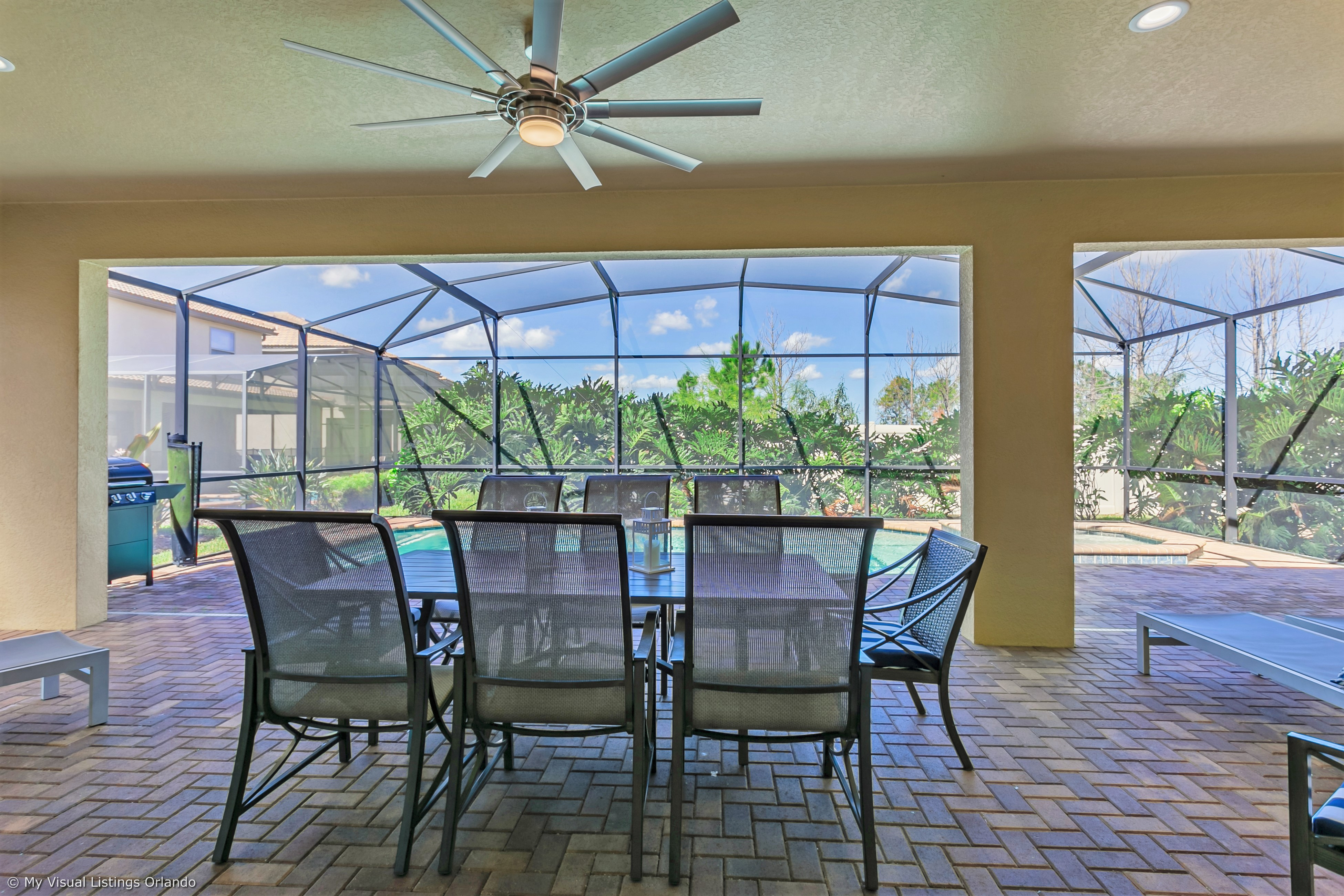 Grand patio with tables and loungers