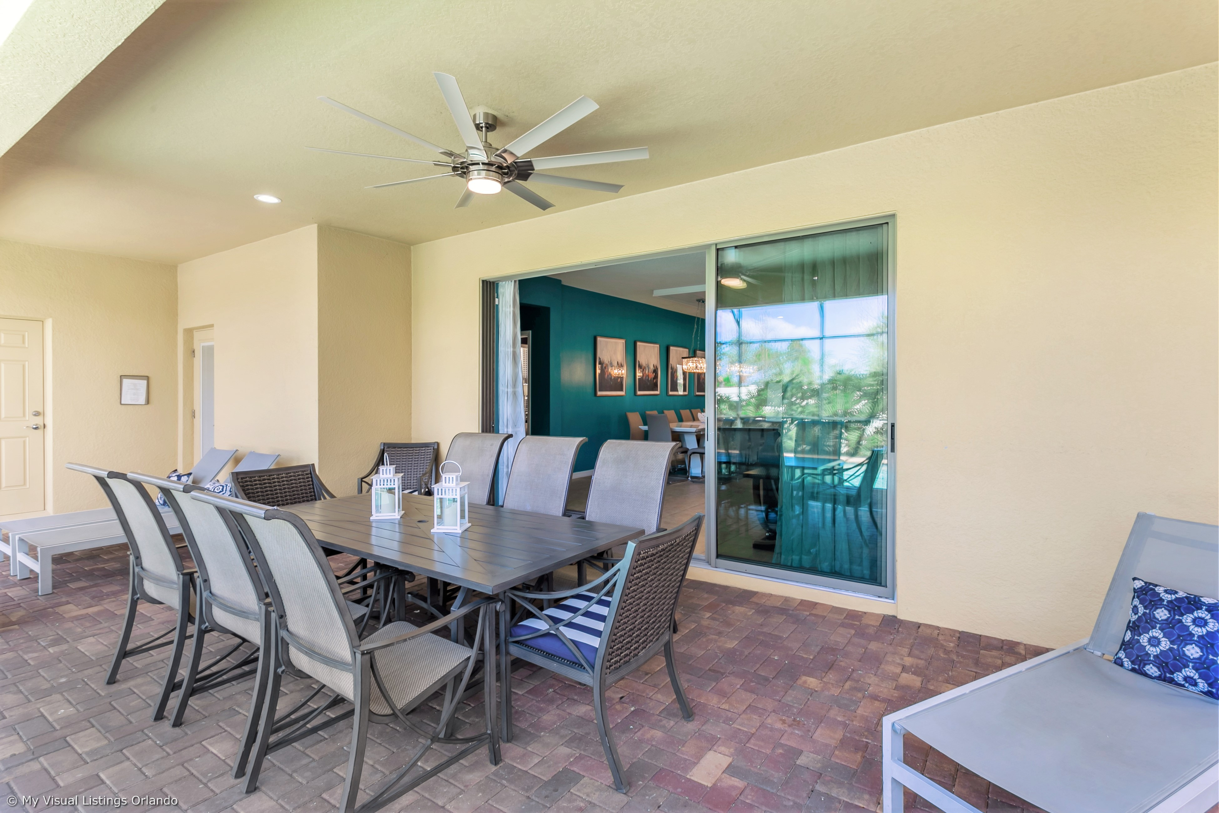 View 2 of grand patio with tables and loungers