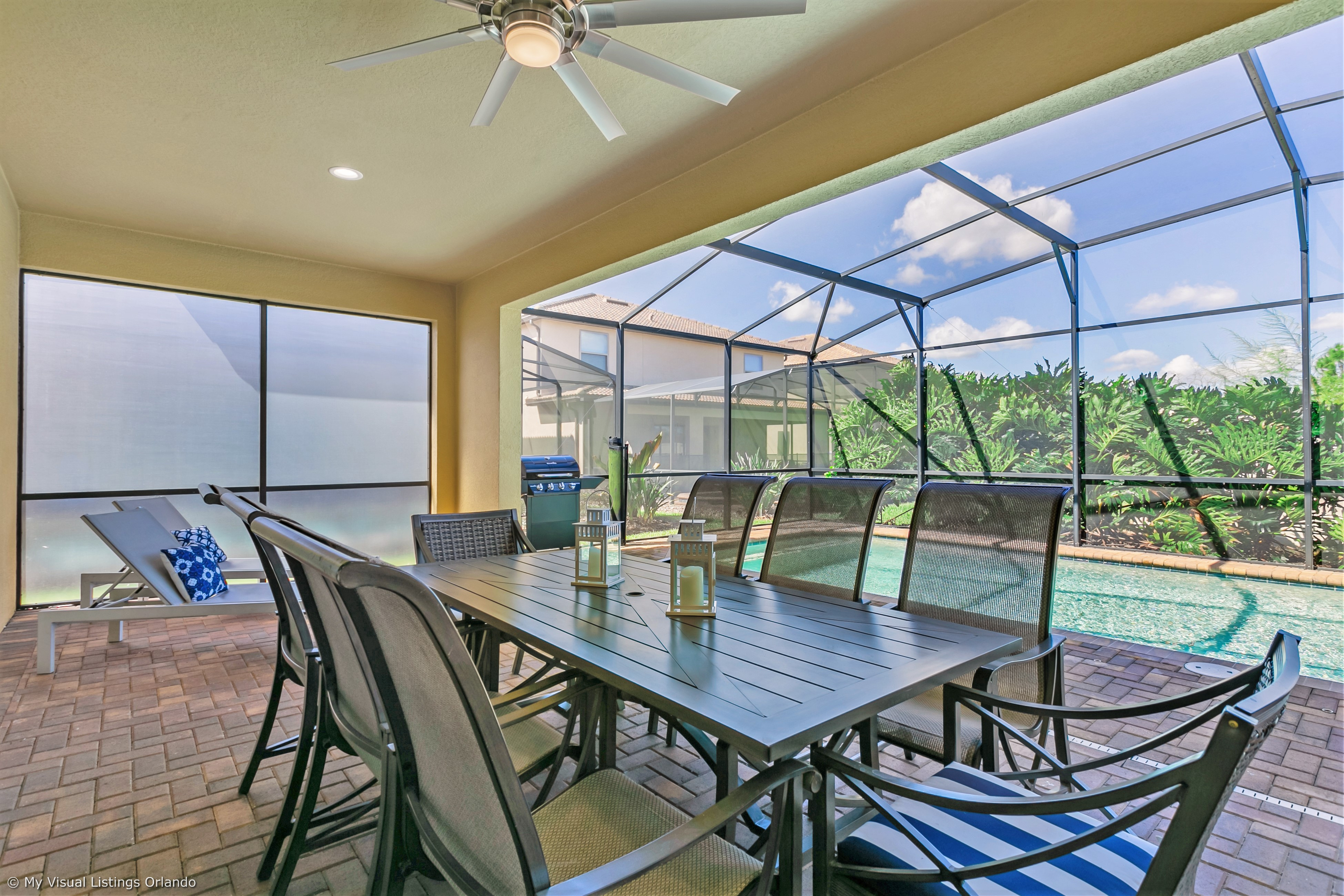 View 3 of grand patio with tables and loungers
