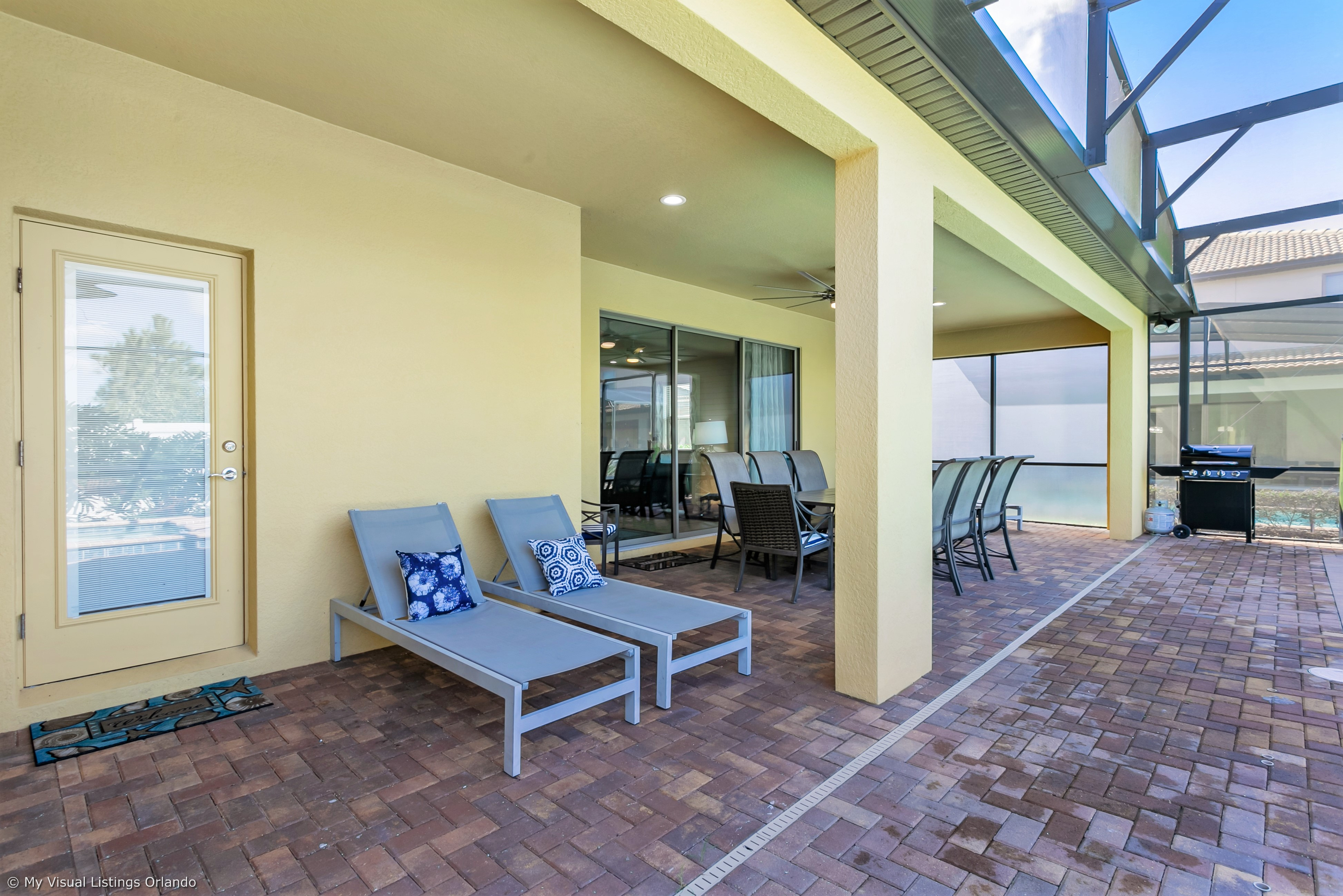 View 4 of grand patio with tables and loungers