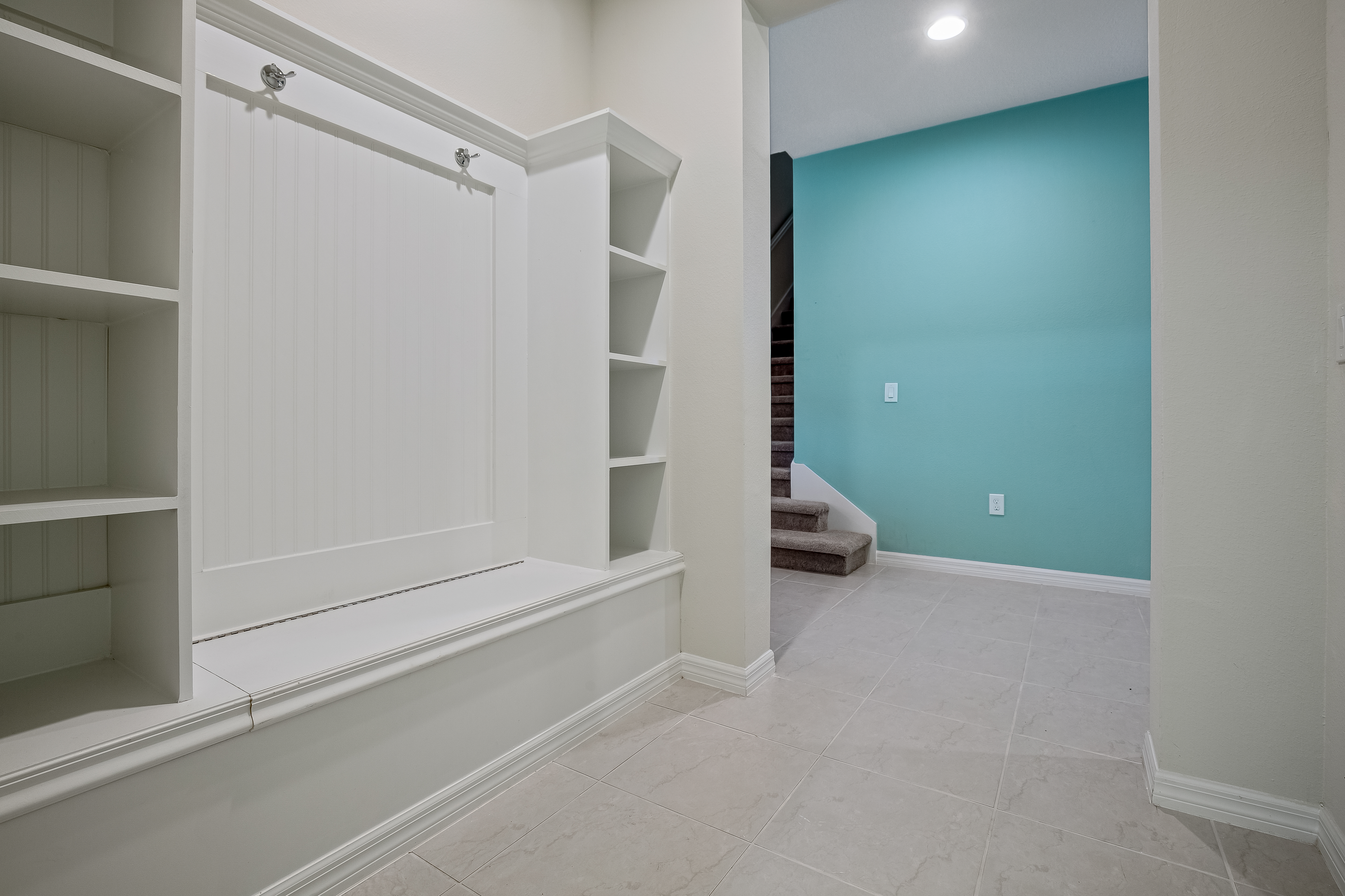 Convenient laundry room with full size washer and dryer