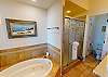 Separate jetted tub and shower provide ample options for washing away the day in relaxation mode.