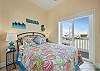 The queen sized bedroom with balcony and Santa Rosa sound biew on the second floor