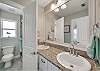 Dual sinks, walk in shower and separate water closet 