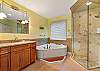 En suite bath with soaker tub and walk-in shower