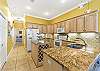 Fully equipped kitchen with plenty of counter and cabinet space to prep meals and snacks for your entire group.