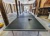 Ping pong table in the garage for some fun friendly competition