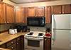 Full Kitchen with Refrigerator, Stove, Dishwasher, and New Microwave