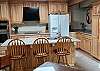 Nice kitchen with newer cabinets and appliances. Large island can seat 3. Flat top stove, double oven. 