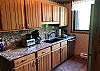 Full Kitchen with Stainless Appliances, Refrigerator, Stove, Microwave, Dishwasher. Coffee Pot. Granite Counter Tops