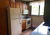 Full Kitchen with Refrigerator, Dishwasher, Stove, Microwave, Granite Counter Tops and Coffee Pot 