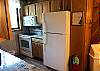 Full Kitchen with Refrigerator, Stove, Dishwasher, Microwave, and Granite Counter Tops