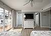 Bedroom 2 - on kitchen level, on South side an/or right as you're facing the street. Has 3 beds (full, queen, and twin)