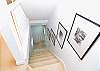 Vintage Photos Lining 3rd Floor Stairway