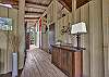Hallway on screened porch leading to bedrooms