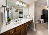 This private master bathroom includes plenty of vanity space