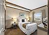 Guest bedroom features a soft comfy queen size bed for two guests.