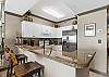 You have extra cooking space here. The smooth range stove makes cooking a breeze. F