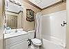 For those occupying the hallway bunks and the guest room. Shower/tub combo.