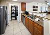 Featuring stainless steel appliances, granite counter tops and ample storage space