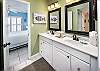 The updated vanity area of the bathroom provides a bright and clean look.