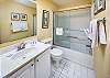 Features shower/bath combo and large vanity with plenty of storage.