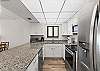 This unit features stainless steel appliances & lots of cabinet and counter space 
