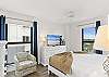 This bedroom has a TV & a windows for some Florida sunshine!