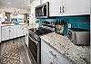 Featuring stainless steel appliances with lots of cabinet & counter space