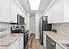 Features stainless steel appliances with lots of cabinet & counter space.
