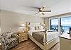 Features a walk-in closet and a king size bed.
