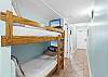 The hallway offers space to the younger ones in the group each bunk bed is equipped with their very own flat screen tv