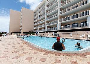 Our 80 foot heated swimming pool is beachside! The deck also holds a hot tub and ample space for basking in the warm Florida sun. (NOT A VIEW FROM THE UNIT)