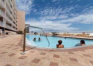 Our 80 foot heated swimming pool is beachside! The deck also holds a hot tub and ample space for basking in the warm Florida sun. (NOT A VIEW FROM THE UNIT)