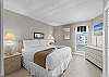 This spacious bedroom has a comfy King sized bed