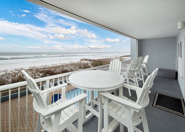 Gulf front balcony with huge property pool below.