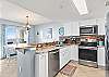 Full service kitchen with granite countertops and stainless steel appliances 