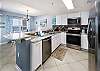 Full service kitchen with granite countertops and stainless steel appliances 