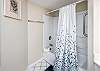 Spacious master bath with shower/tub combo and double vanity