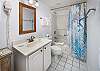 Full size guest bathroom with shower/tub combo