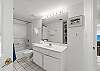 Featurs a shower/tub combo and access from the third bedroom and the hall.