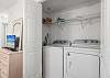 Washer and dryer are located in this bedroom.
